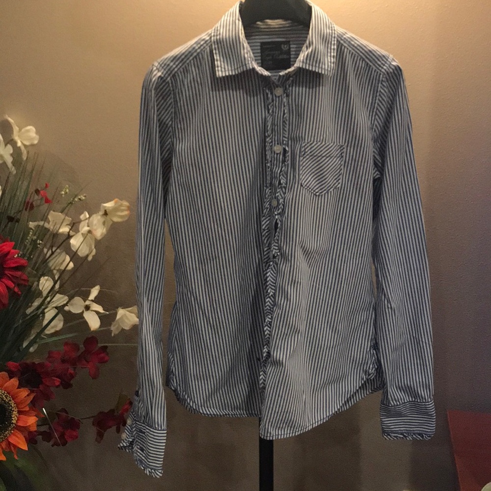 Pinstriped ruffled button down dress shirt.